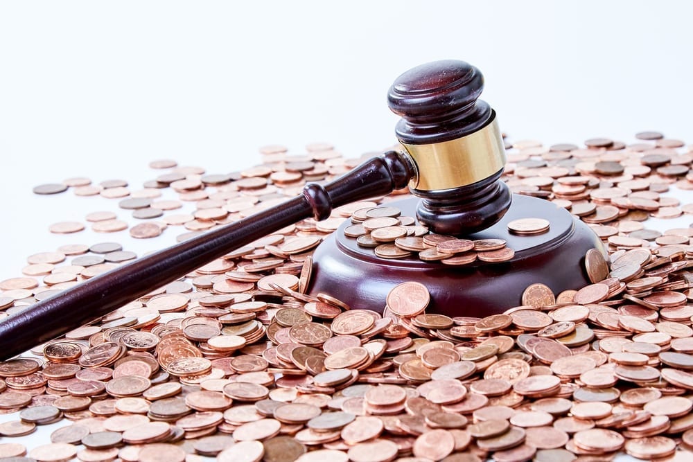 A gavel surrounded by pennies