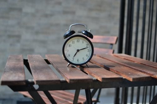 An alarm clock on an outdoor table