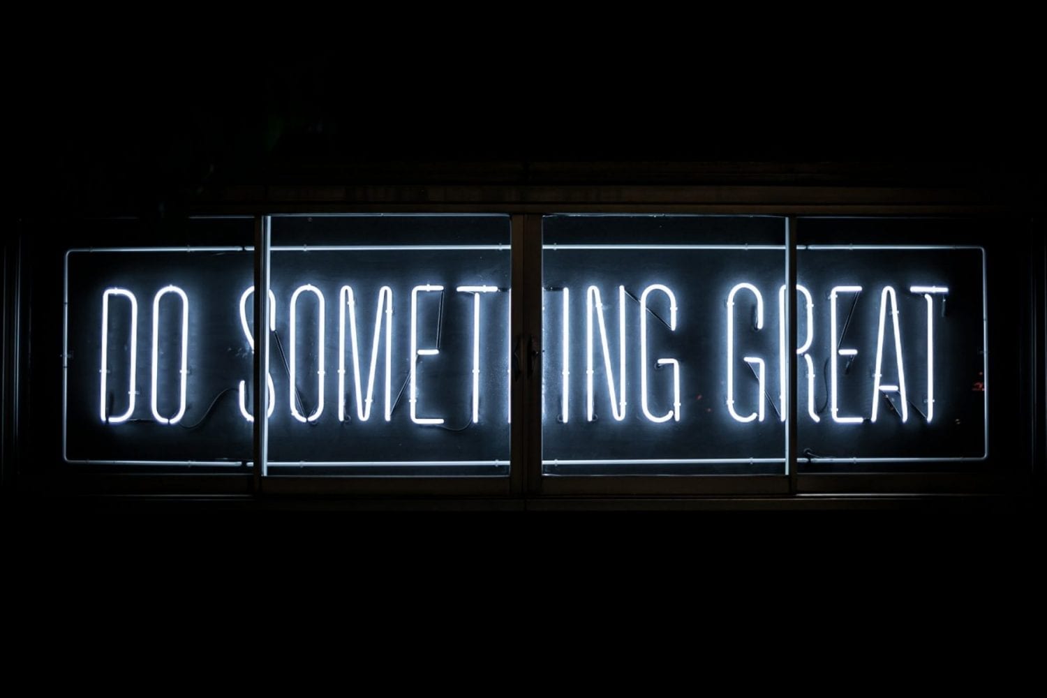 Neon sign reading "Do Something Great"
