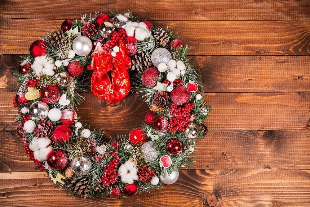 A Christmas wreath on a wooden tabletop