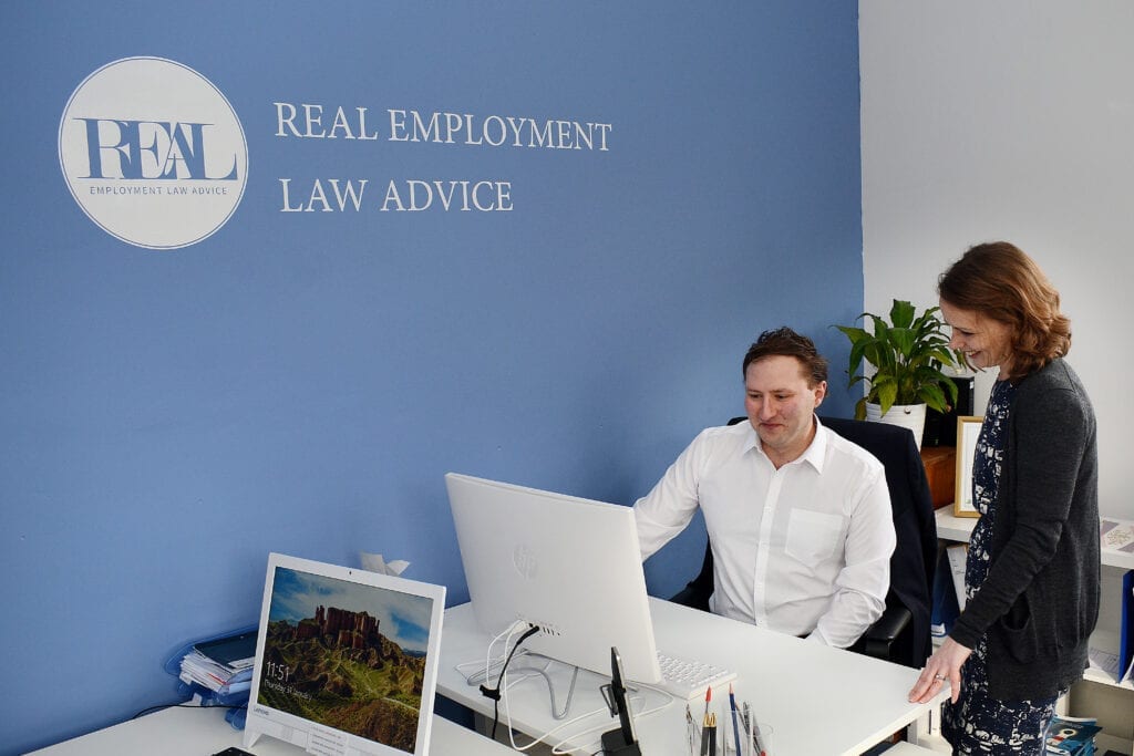 Two team members working in the Real Employment Law Advice offices
