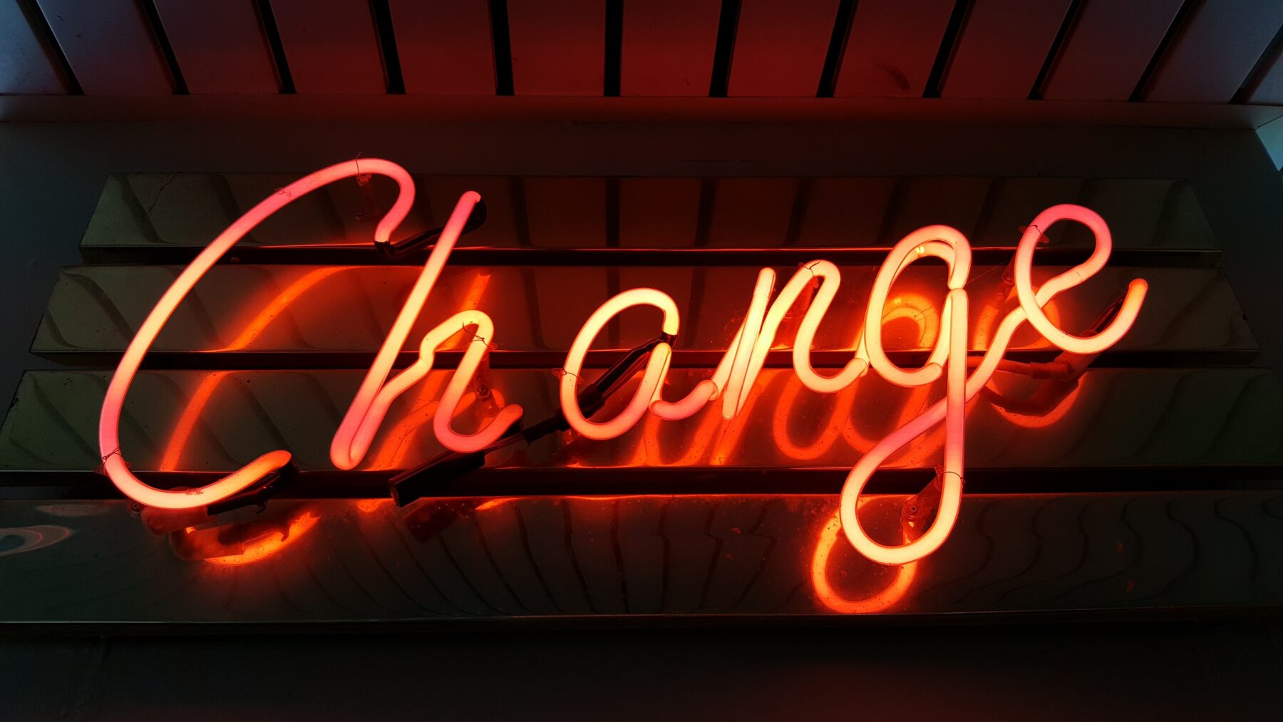 A neon sign with the word "Change"