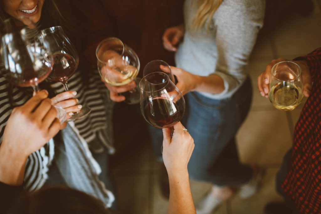 group of people holding drinking glasses