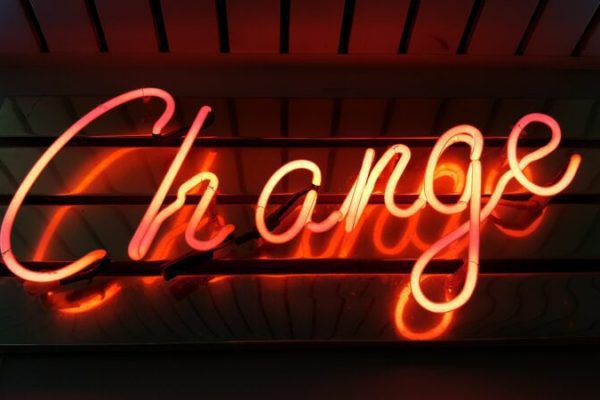 A neon sign with the word "Change"