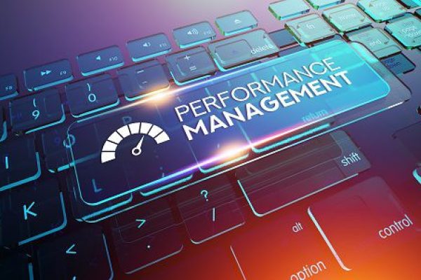 A futuristic keyboard with a floating "Performance Management" button